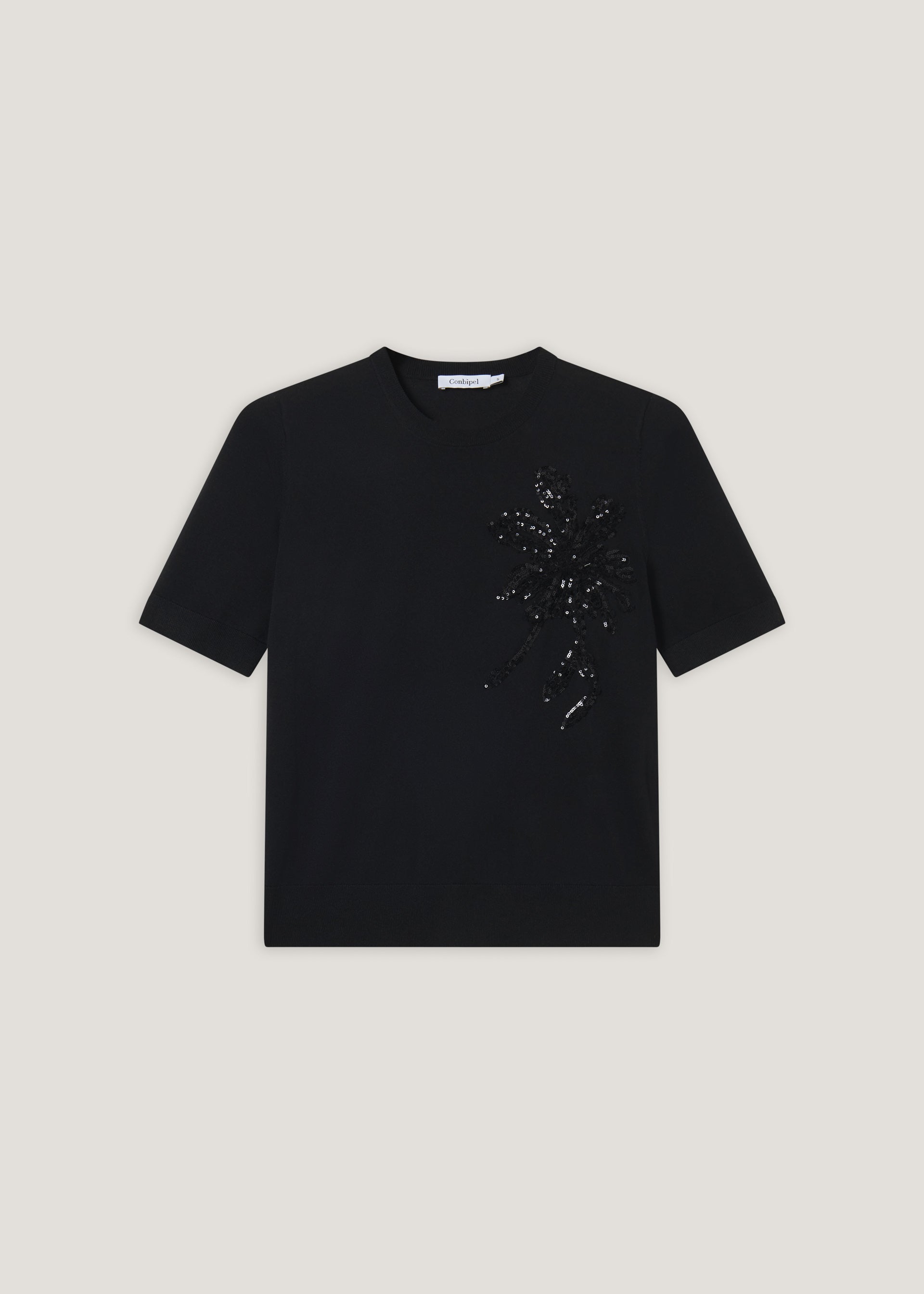 T-shirt in maglia con applicazioni