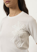 T-shirt in maglia con applicazioni
