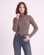 Maglione a collo alto con trecce